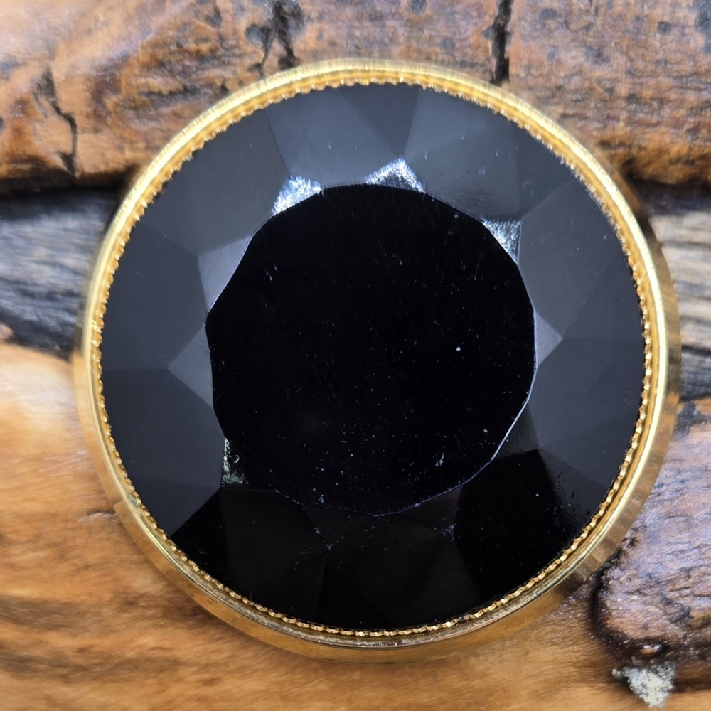 1928 Brand Brooch Faceted Black Opaque Glass with Gold Tone Bezel & Frame